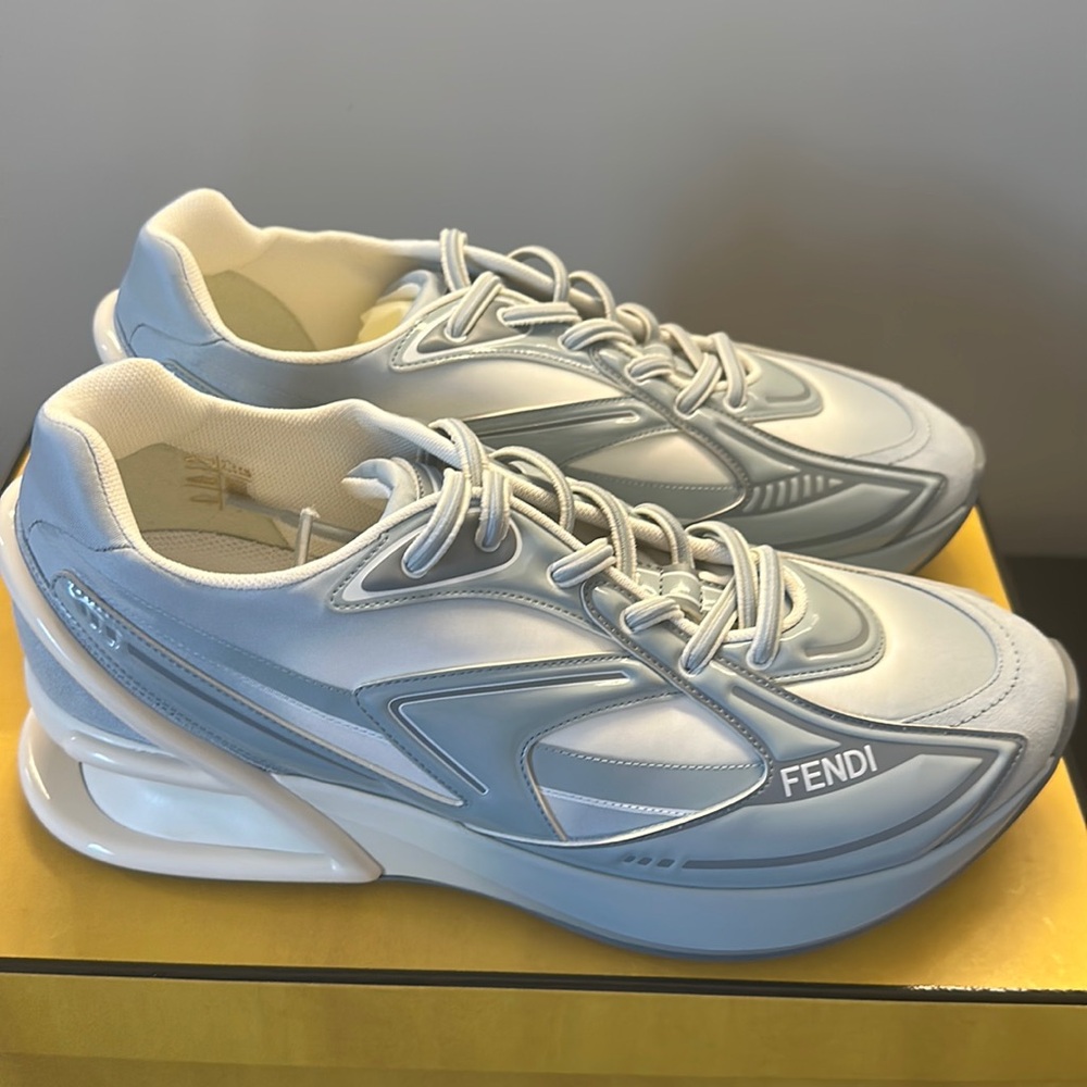 First 1: Light blue nylon low tops